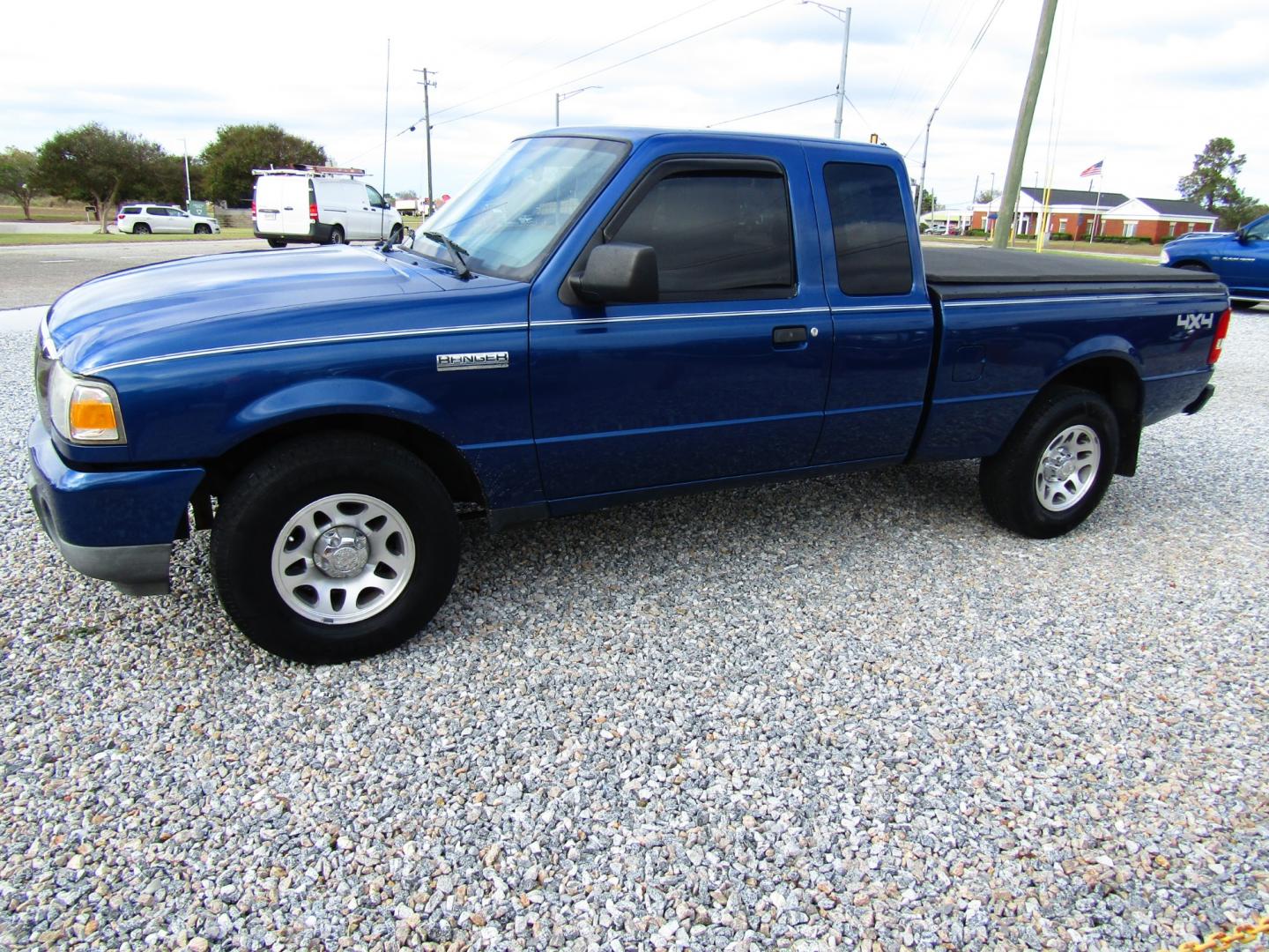 2010 Blue /Black Ford Ranger Sport SuperCab 4-Door 4WD (1FTLR4FE6AP) with an 4.0L V6 SOHC 12V engine, Automatic transmission, located at 15016 S Hwy 231, Midland City, AL, 36350, (334) 983-3001, 31.306210, -85.495277 - Photo#2